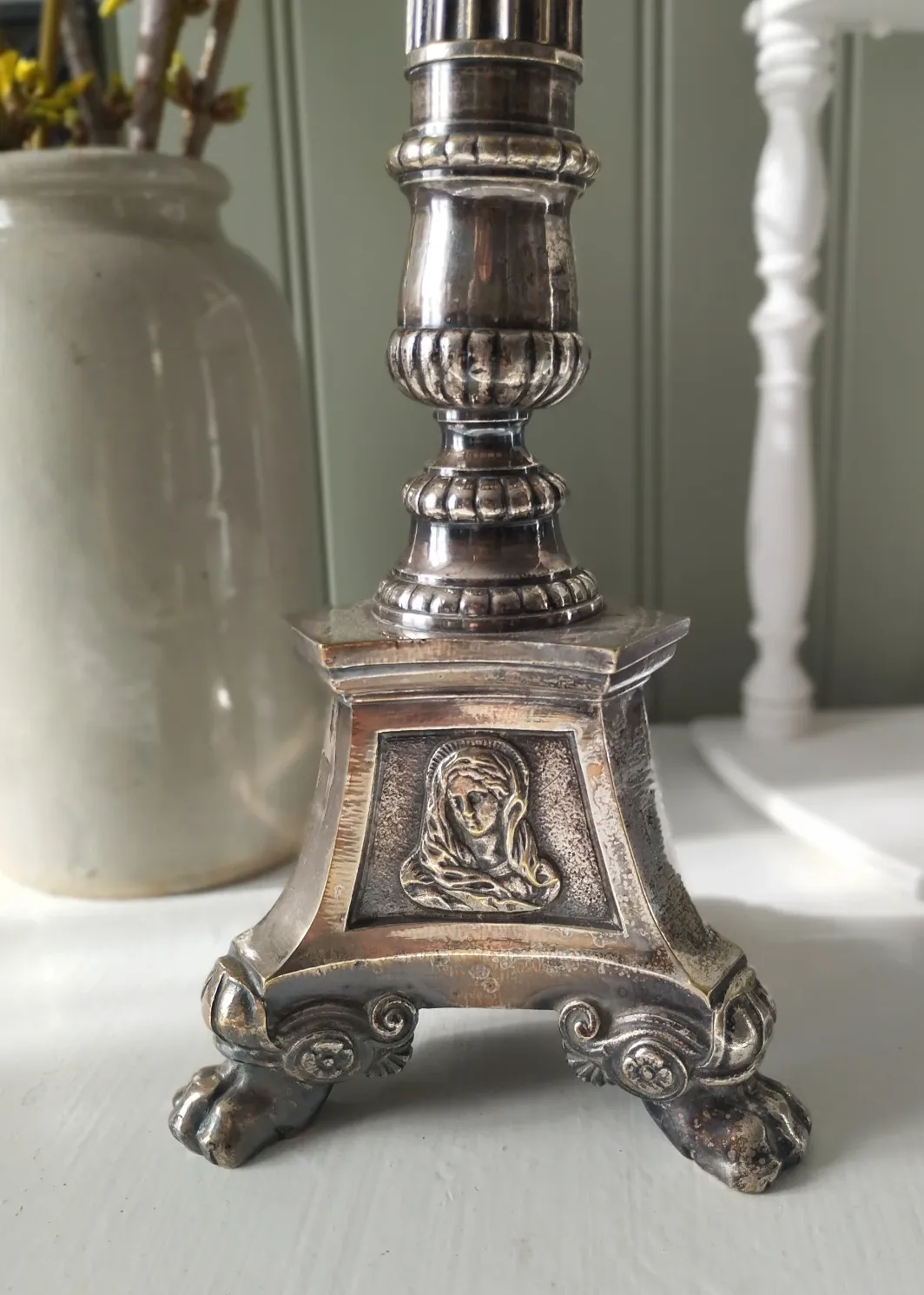 Old church candlestick in silver-plated metal