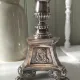 Old church candlestick in silver-plated metal