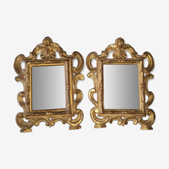 Pair of gilded wooden mirrors with cherub decoration 27x35cm