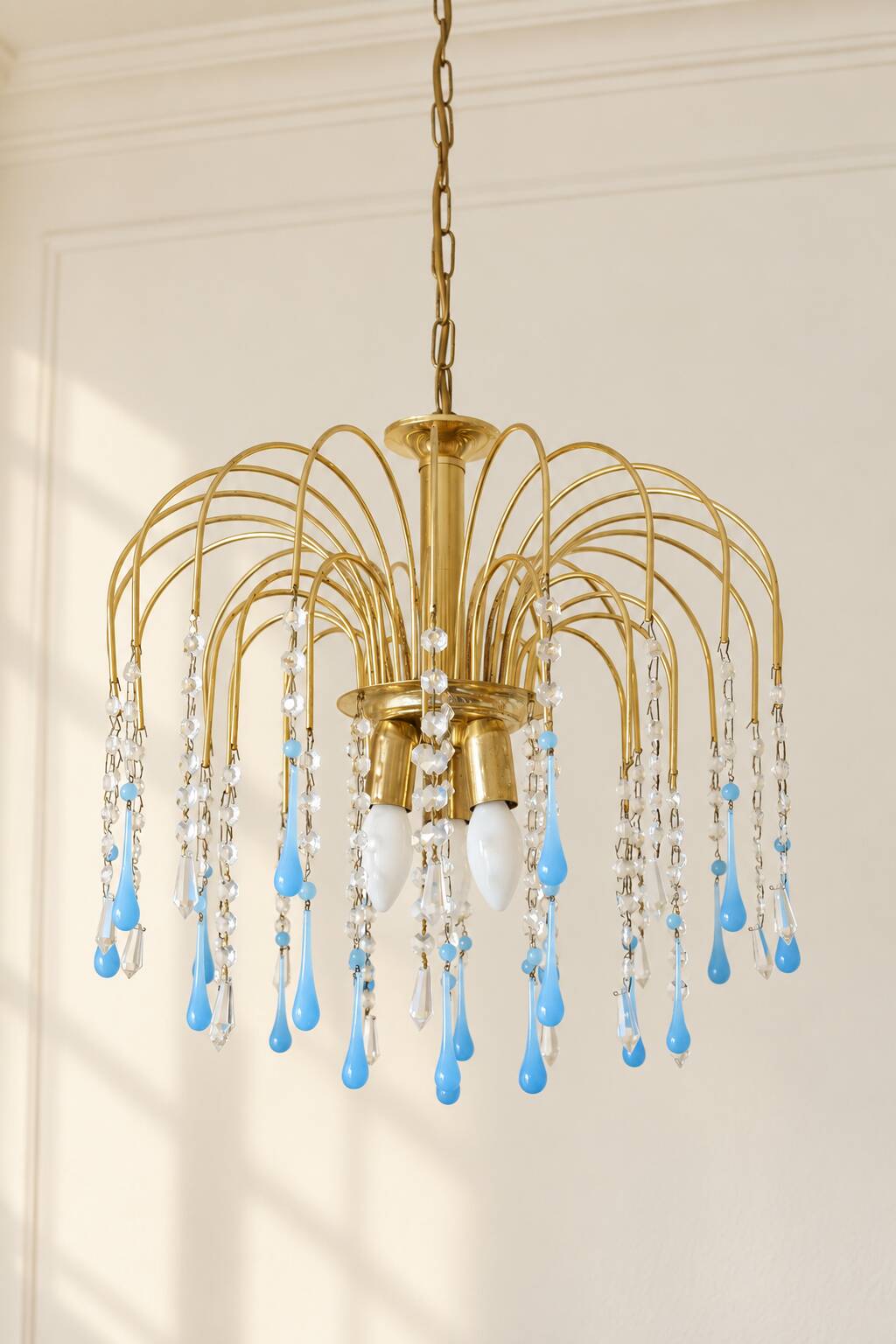 Vintage chandelier with blue Murano glass pendants.