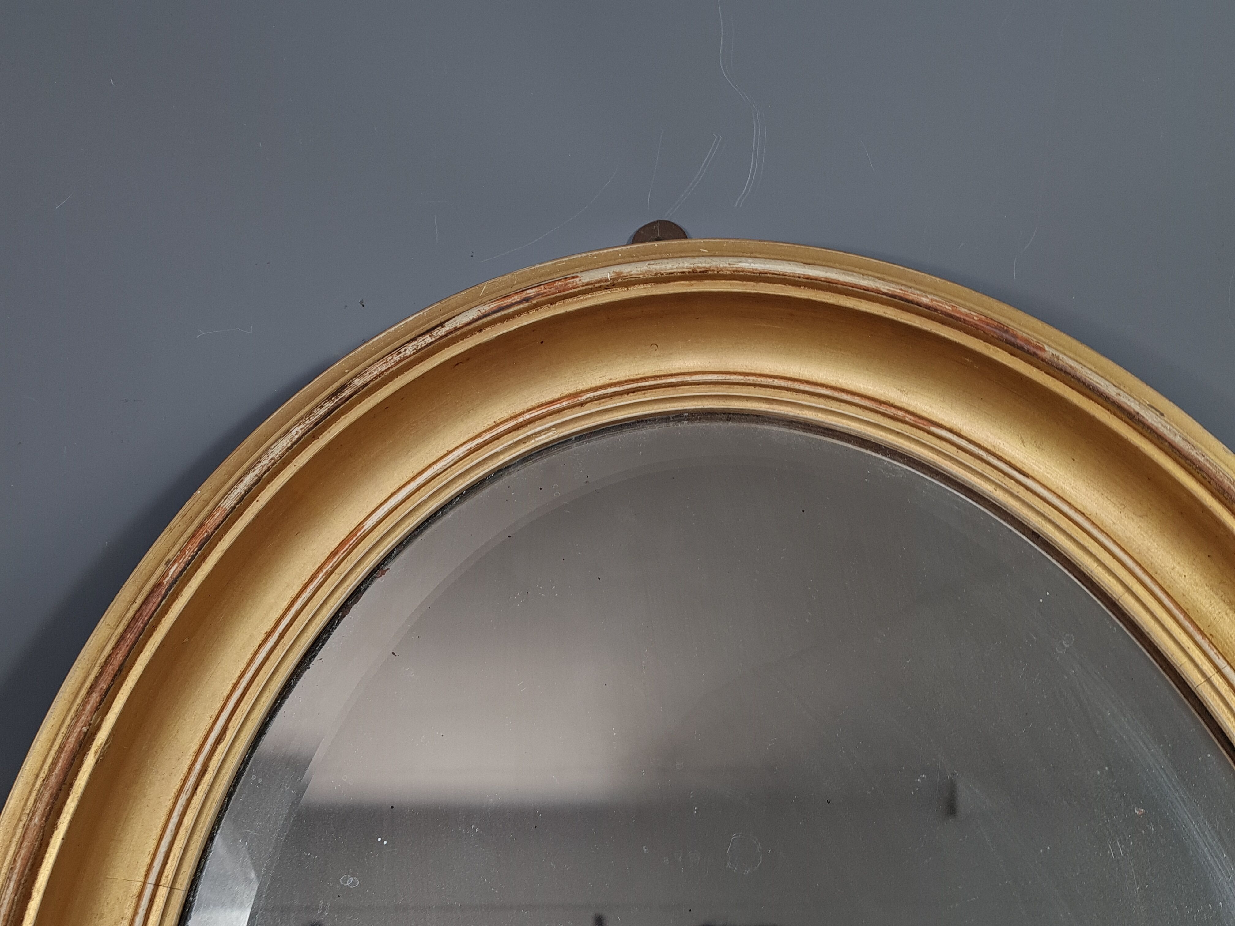 Ancien miroir ovale biseauté bois doré 63x46 cm SB