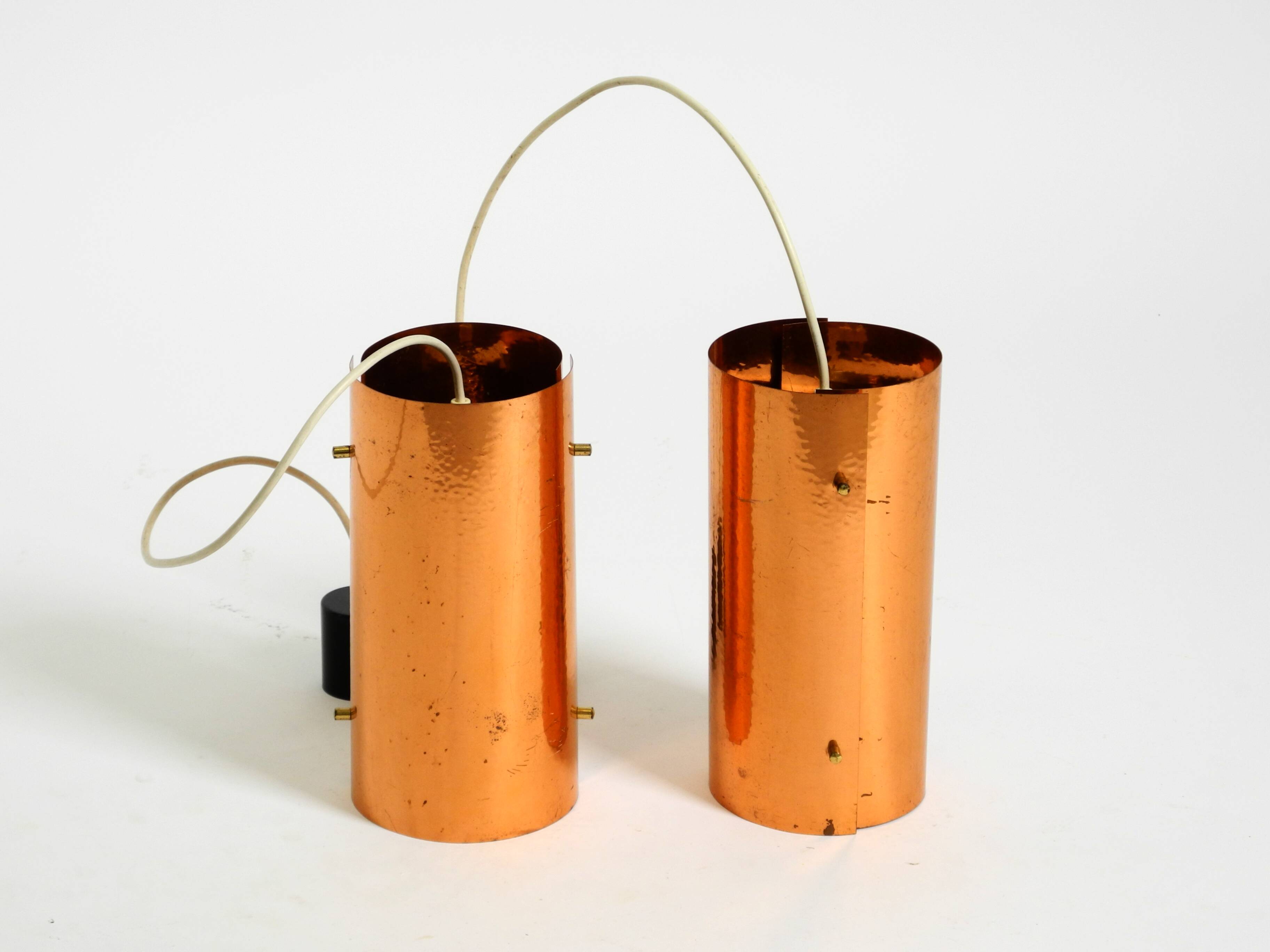Two 50s tube pendant lamps consisting of two screwed-together copper bowls