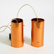 Two 50s tube pendant lamps consisting of two screwed-together copper bowls