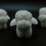 8 porcelain knife rests - Cherubs