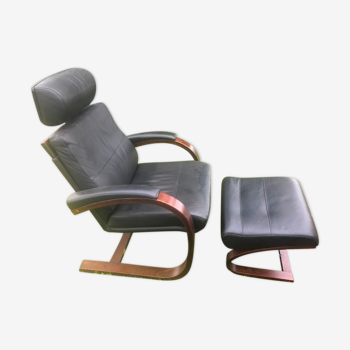 Armchair with its designer footrest Nelo Sweden