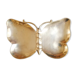 Empty brass butterfly pocket