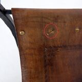 Curule armchair in wrought iron and leather