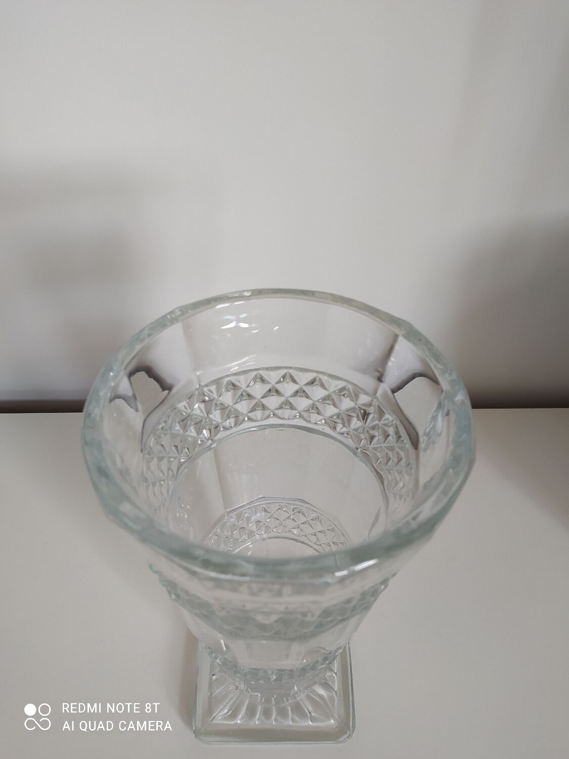 Large carved glass vase on foot