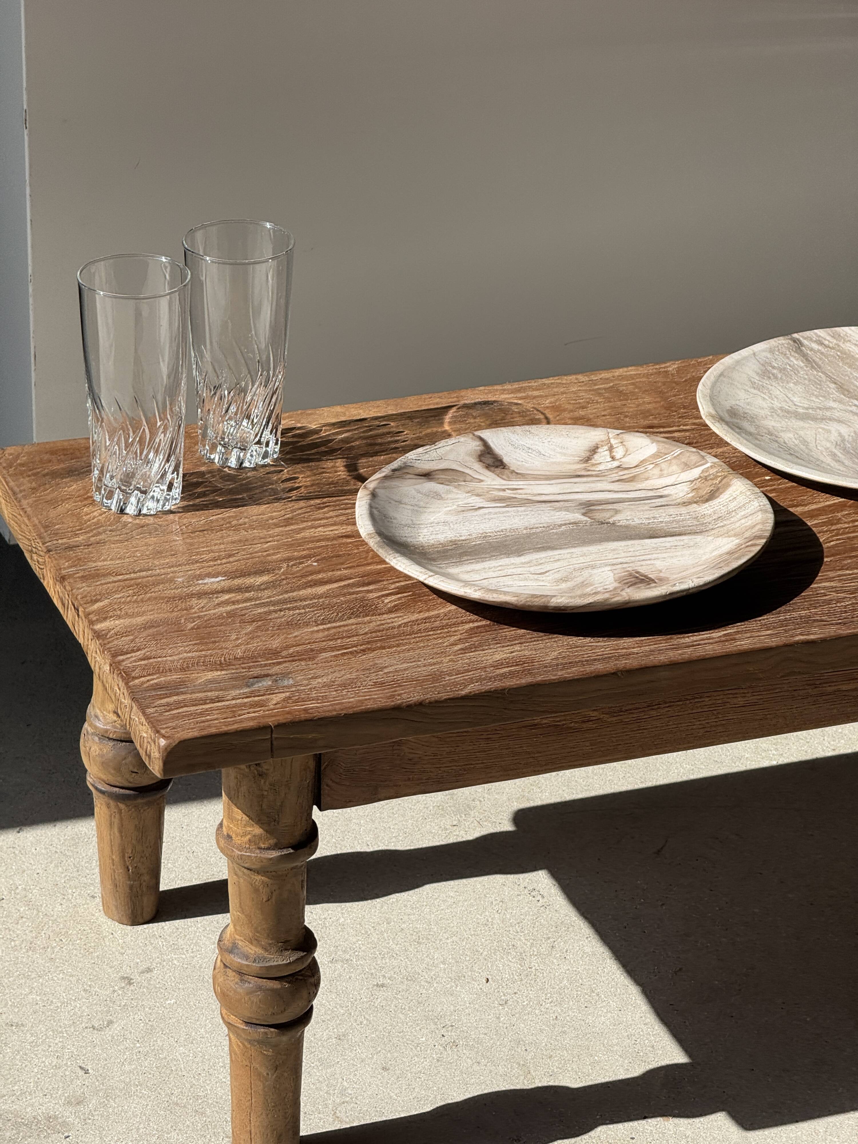 Tray, circular dish or plate made of white striped grey petrified wood.