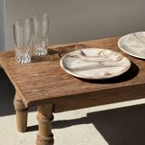 Tray, circular dish or plate made of white striped grey petrified wood.