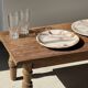 Tray, circular dish or plate made of white striped grey petrified wood.