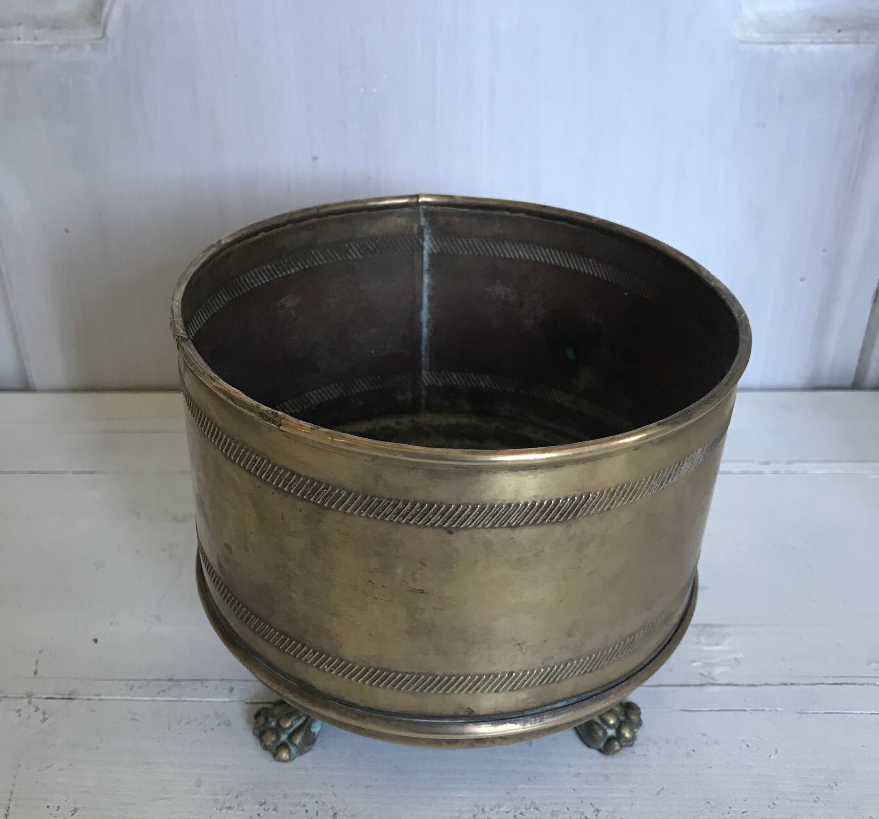 Former brass tripod pot