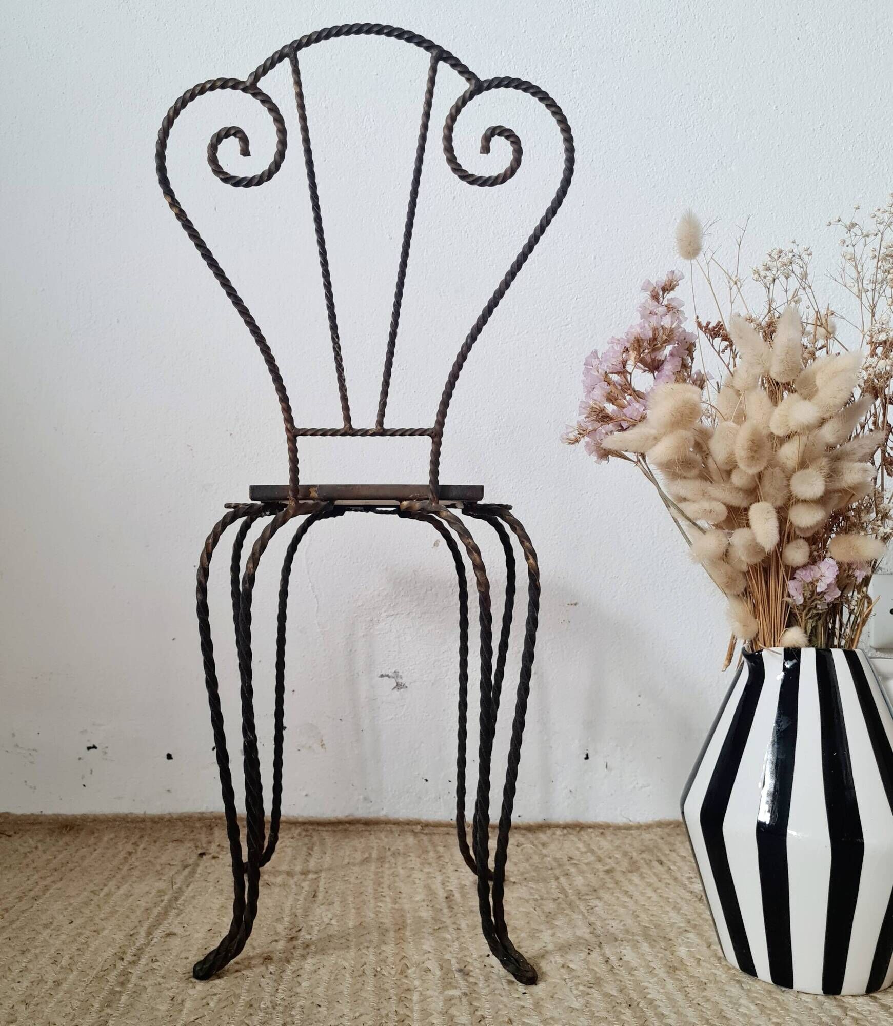 Small chair / stool in twisted wrought iron and floral ceramic.