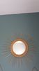 Round sun mirror in wicker rattan