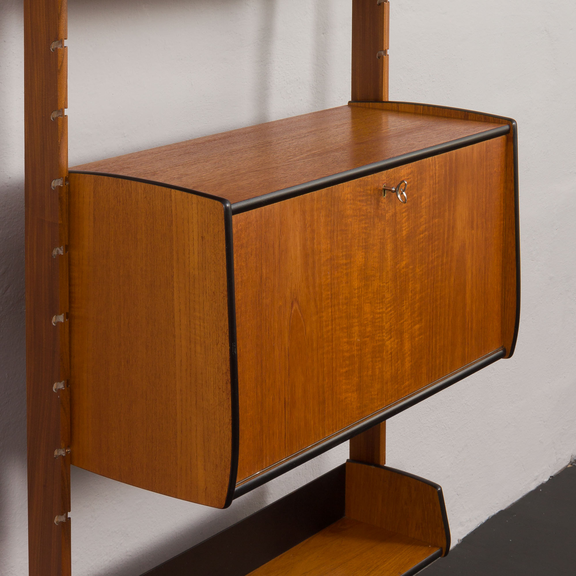 Scandinavian free standing vertical bookcase with a secrtetaire or home office wall unit model Ergo,