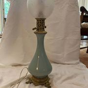 Oil lamp in celadon and bronze with its original glass globe, 19th century.