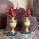 Pair of red corals on gilded and blue wooden bases