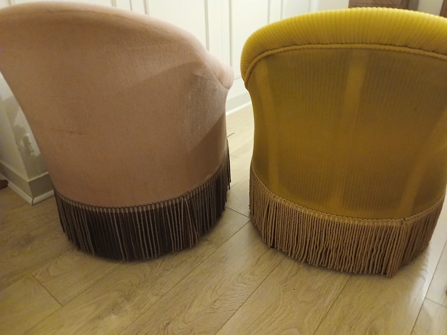 Set of 2 yellow and pink velvet tub chairs.