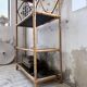 Rattan bookshelf and black glasses