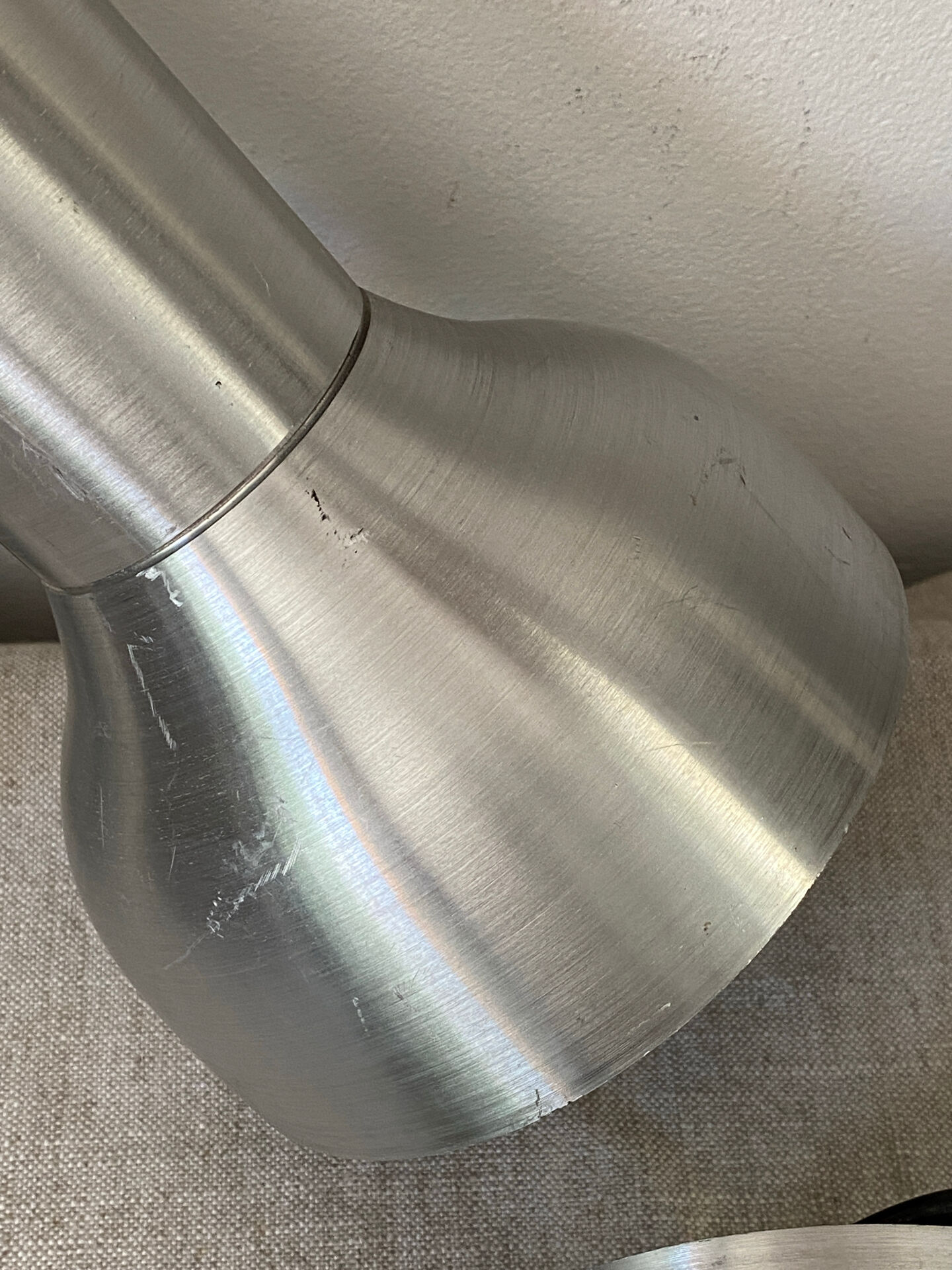 Pair of brushed metal wall sconces