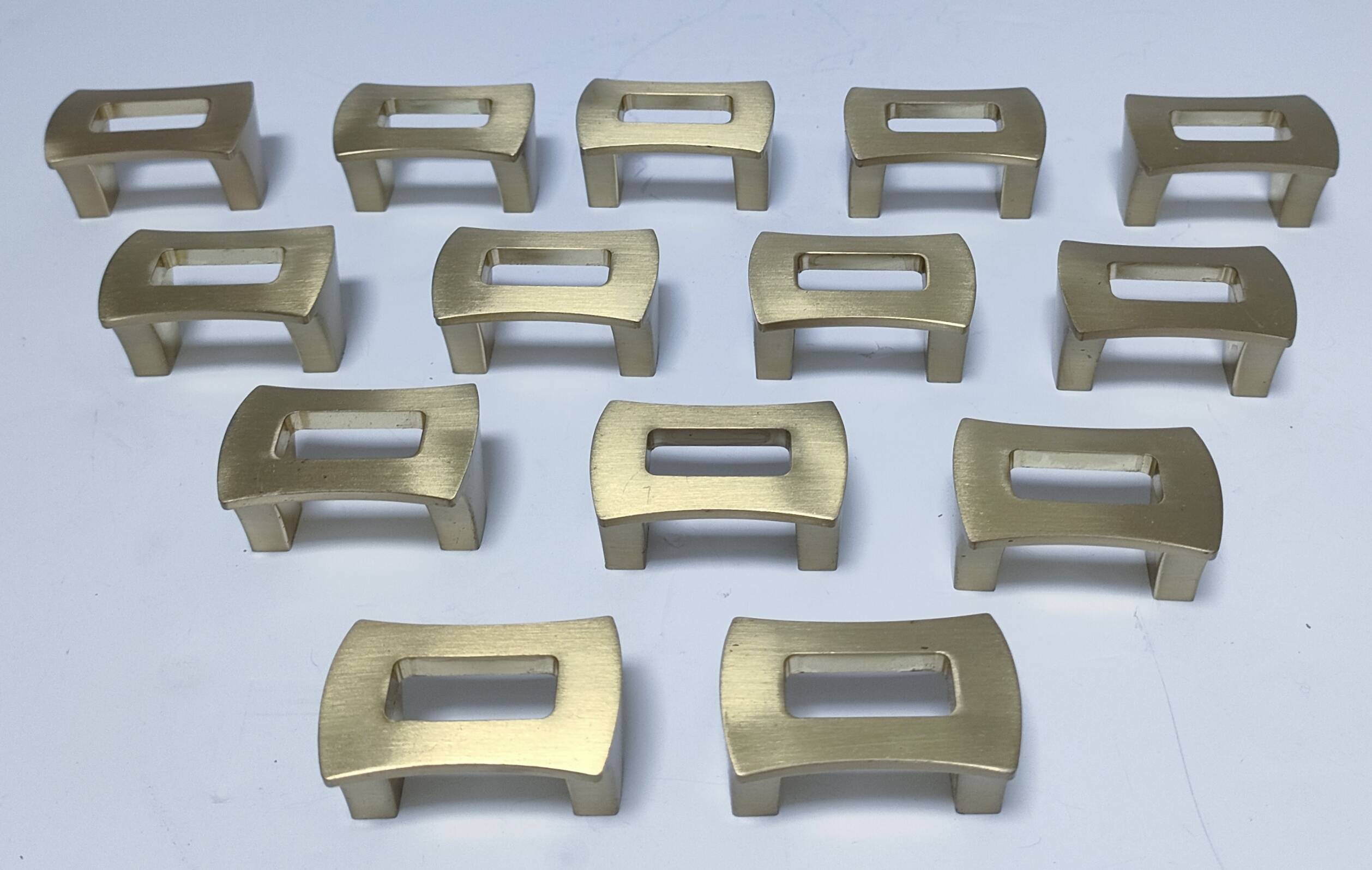 Fourteen 70s design gold steel furniture handles