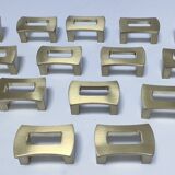 Fourteen 70s design gold steel furniture handles