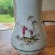 Vase en porcelaine décor polychrome "aux vieux chinois"