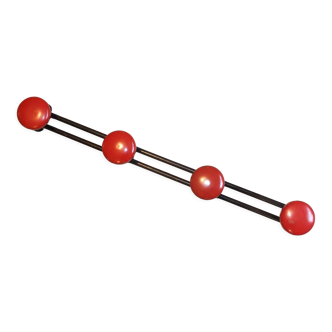 Old red and black coat rack of the 50s metal with 4 hooks