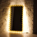 Large luminous acrylic mirror.