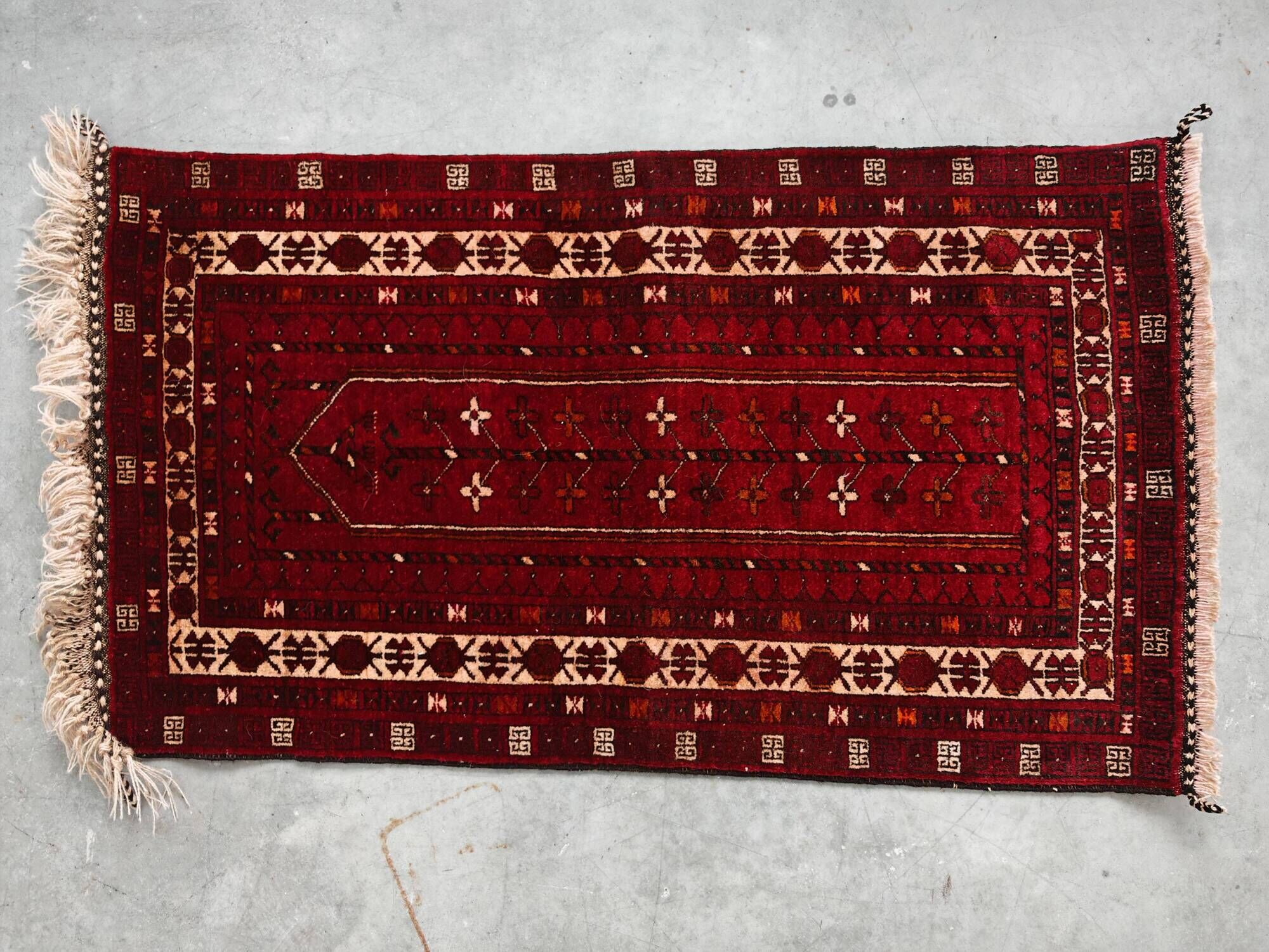 Vintage Afghan tribal prayer rug, hand-knotted from the 1950s.