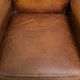 Charming and comfortable vintage armchair in grained cowhide leather with character