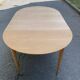 Table à manger scandinave ronde extensible décapée en teck brut 1950