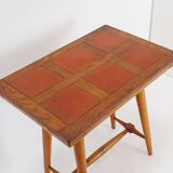 Vintage wooden side table with terracotta top