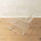 Wonderful side table from the 1960s, high-quality frame and shelf made of transparent acrylic with chrome-plated castors