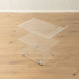 Wonderful side table from the 1960s, high-quality frame and shelf made of transparent acrylic with chrome-plated castors