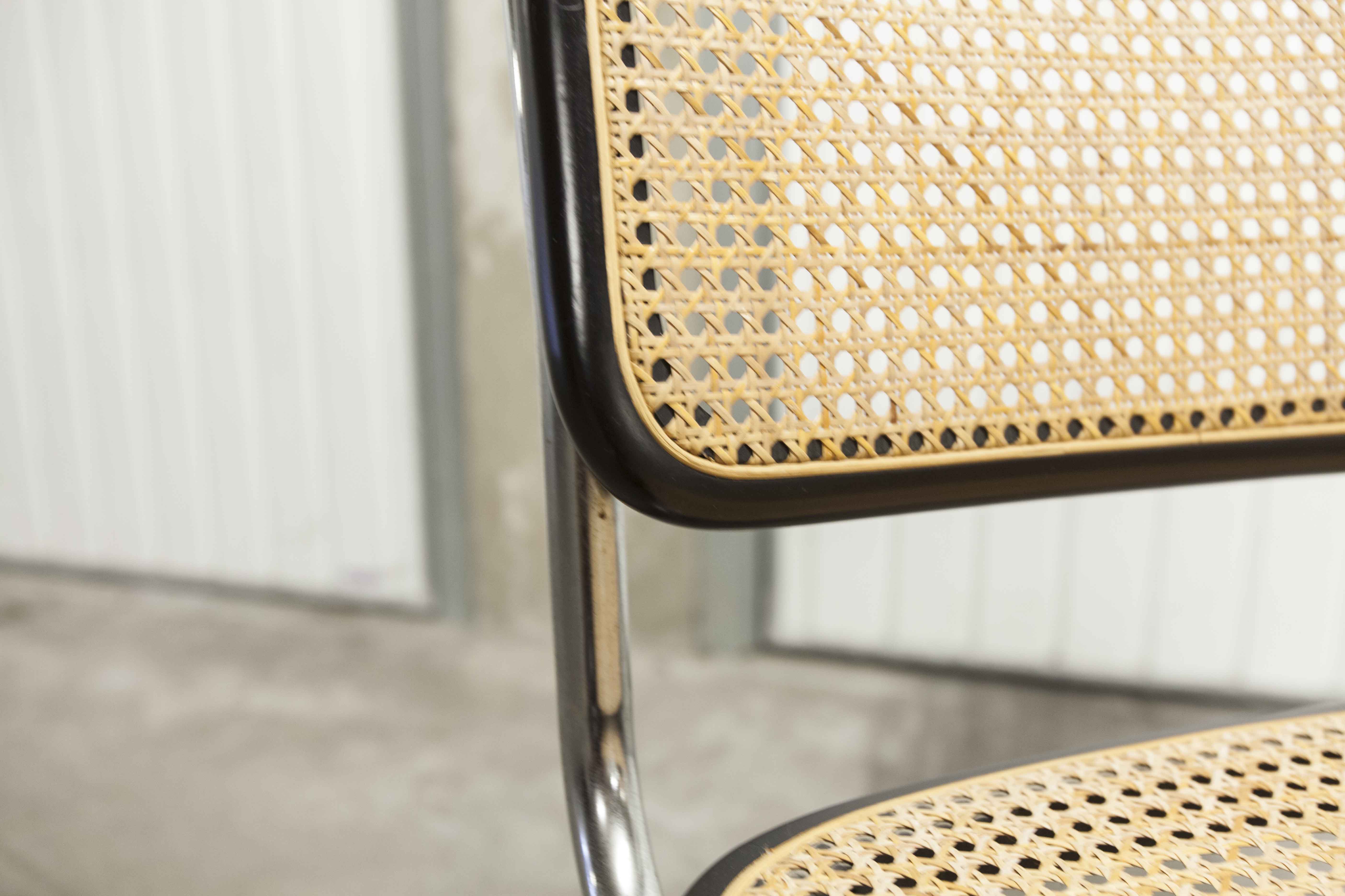 Pair of black Breuer b32 chairs and cannage