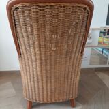Armchair in woven rattan and exotic wood