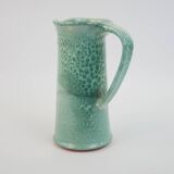 Large green ceramic pitcher with leopard enamel