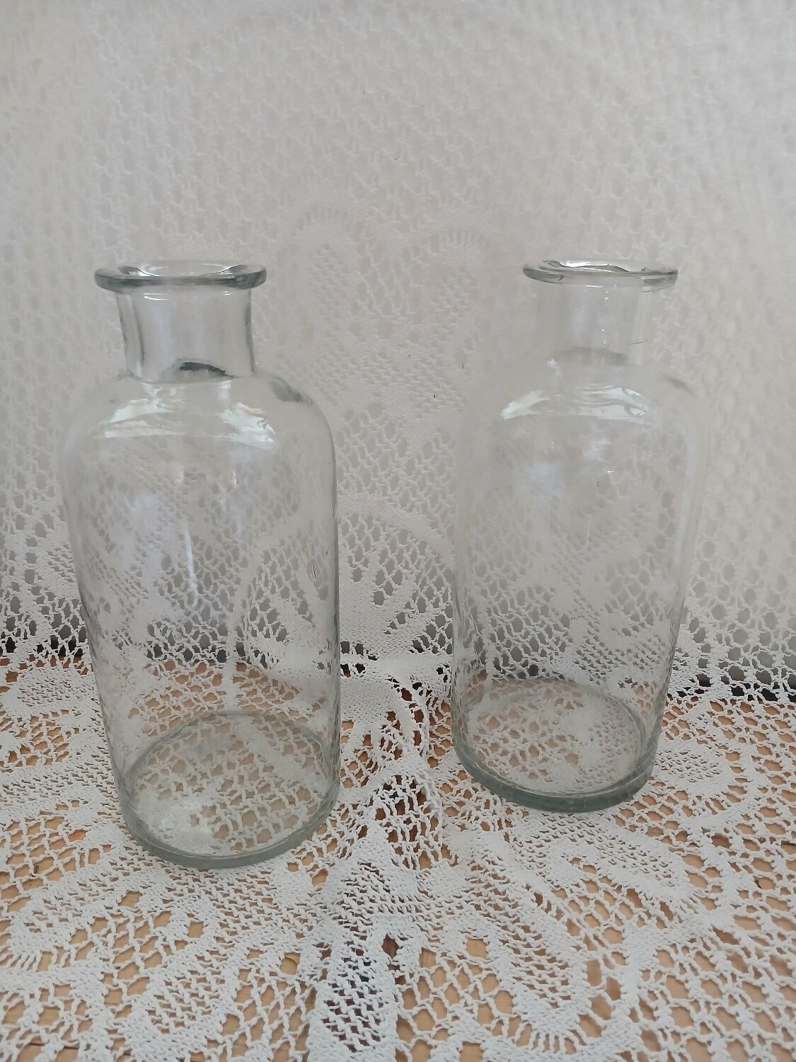 2 large antique transparent glass bottles