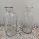 2 large antique transparent glass bottles