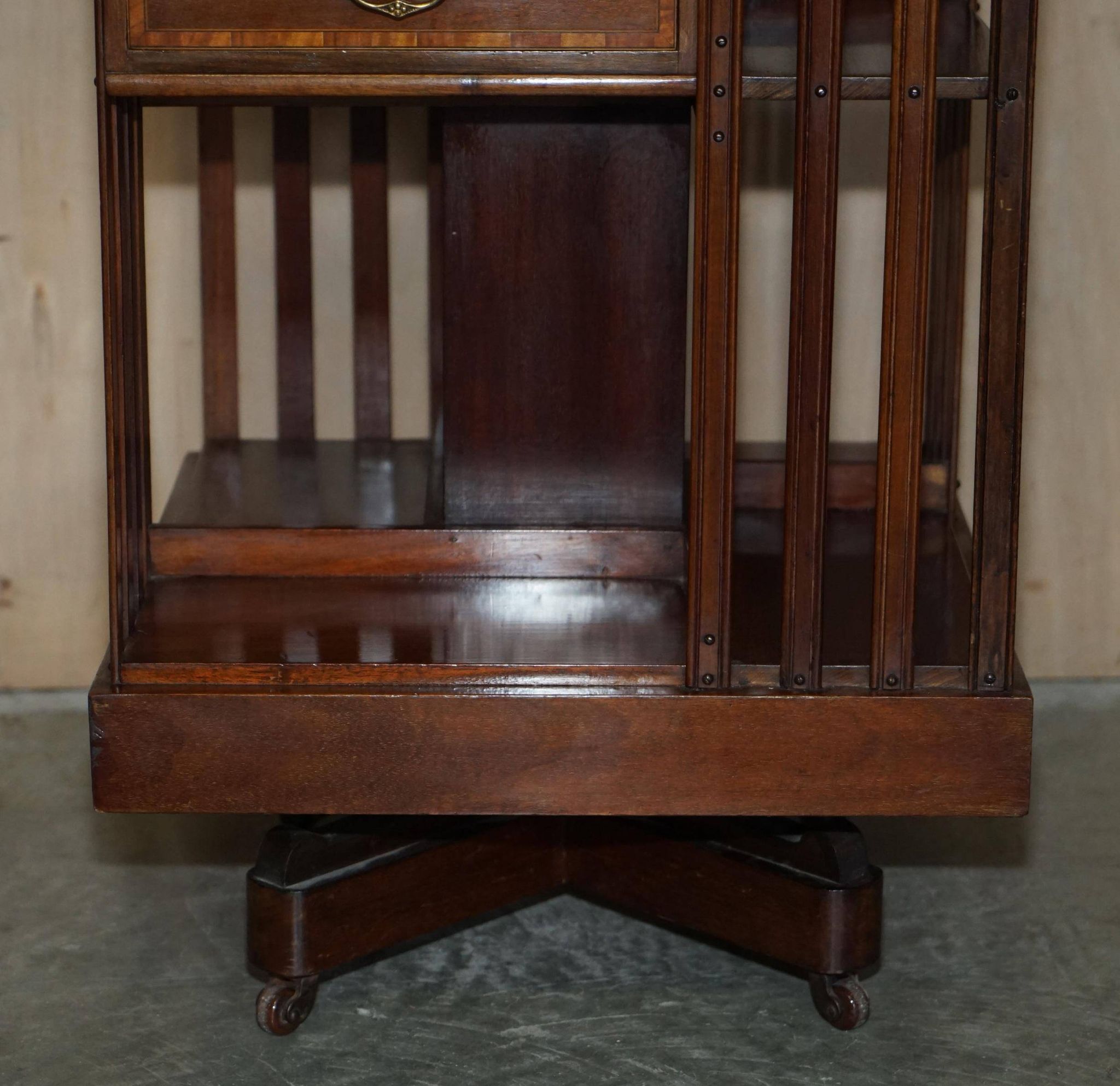 Restored Victorian walnut revolving library.