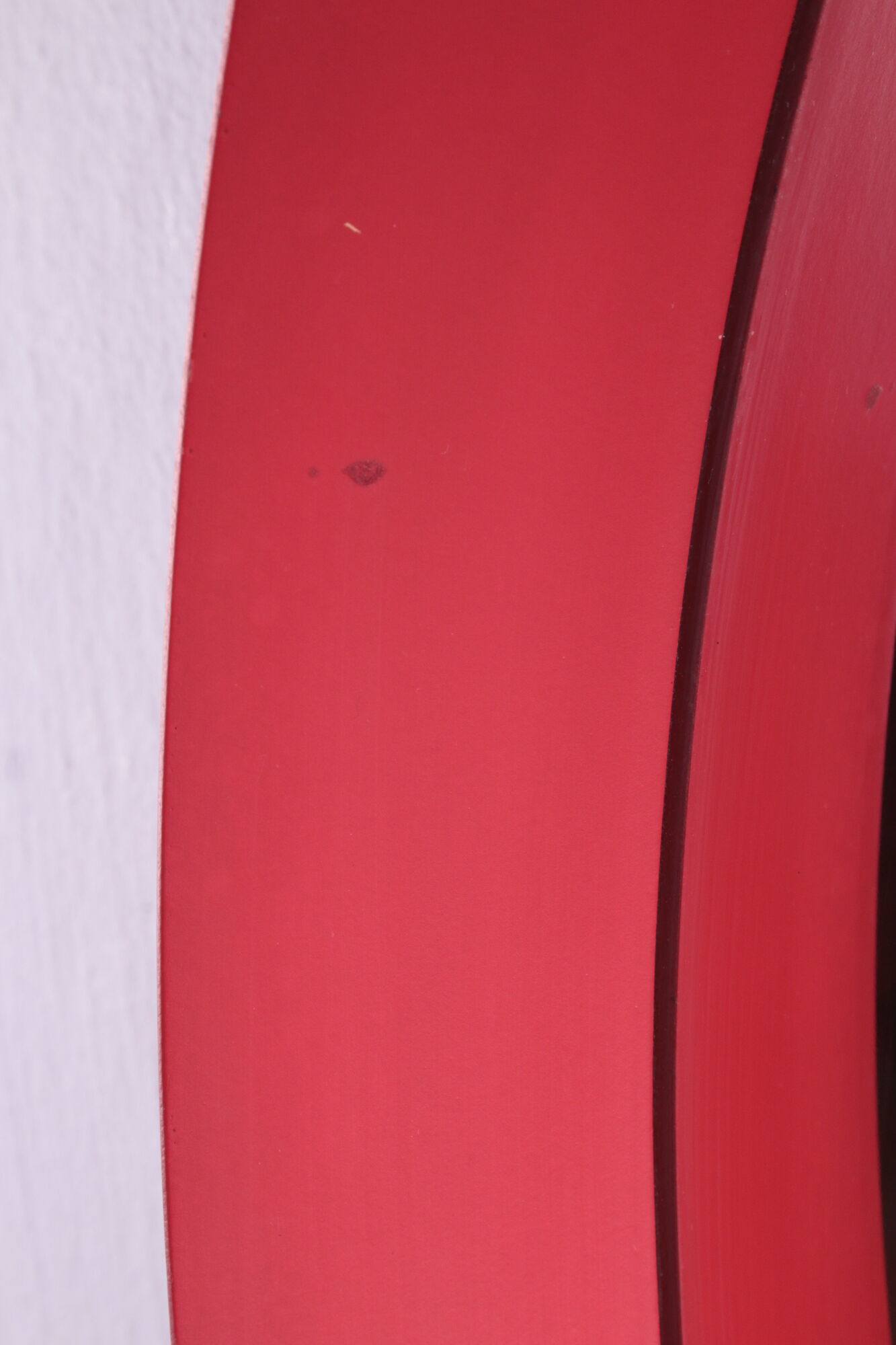 Vintage red round plastic mirror from the 1960s.