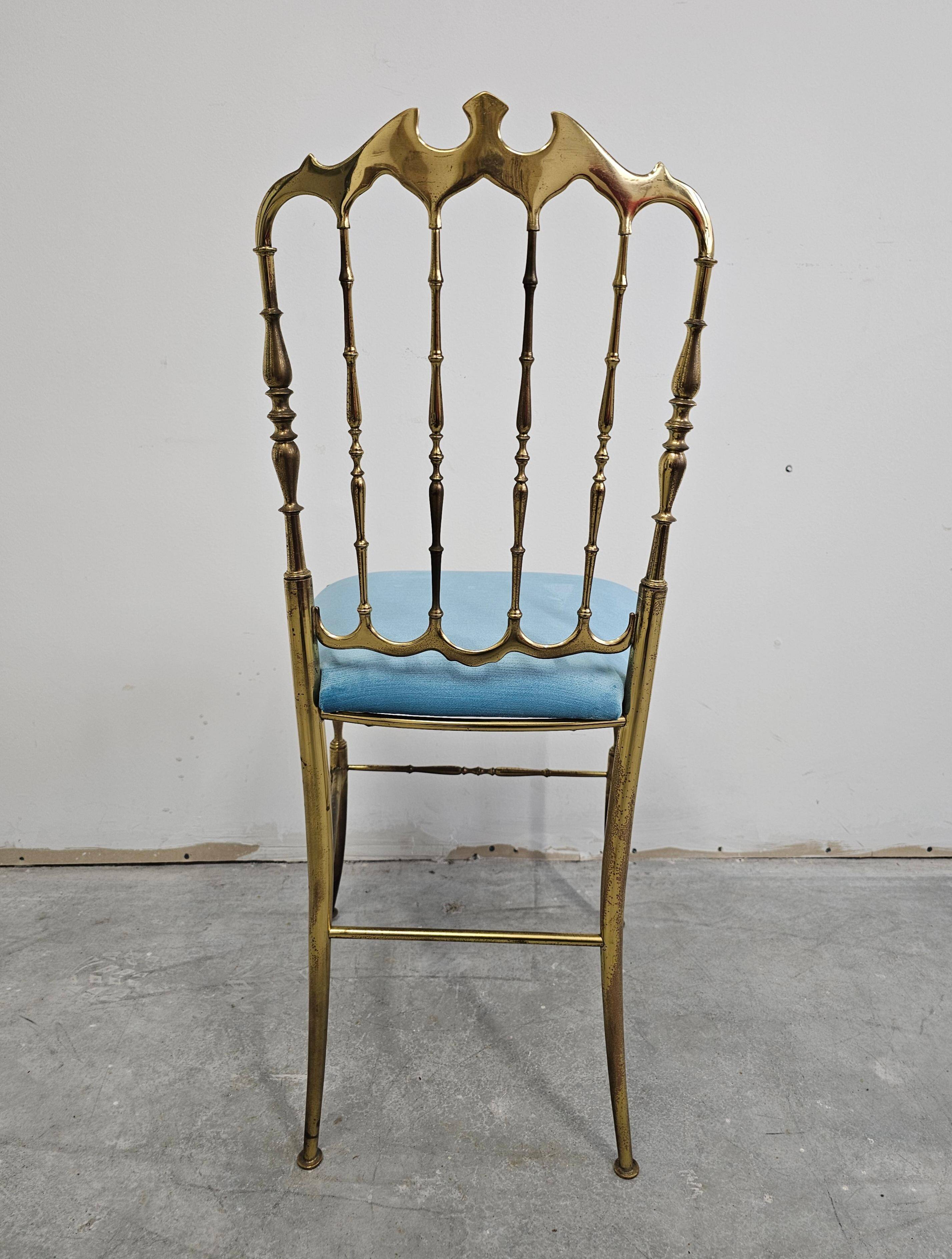 Mid-century Chiavari accent chair in solid brass with a plush seat.