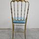 Mid-century Chiavari accent chair in solid brass with a plush seat.