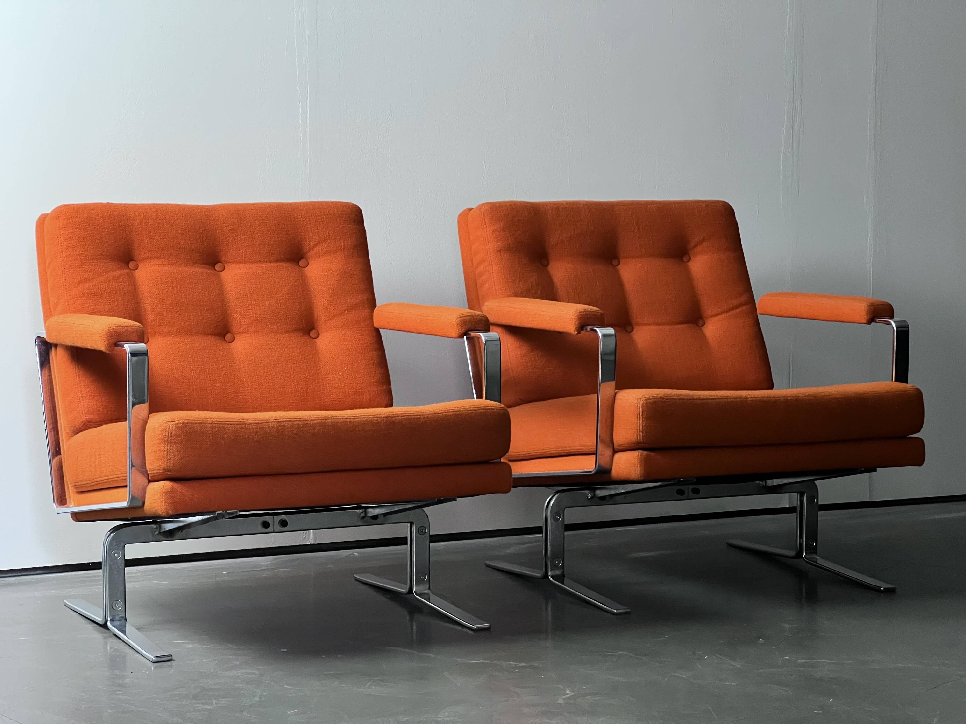 Pair of Karl Erik Ekselius armchair, in orange and chrome Kadrat fabric