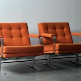 Pair of Karl Erik Ekselius armchair, in orange and chrome Kadrat fabric