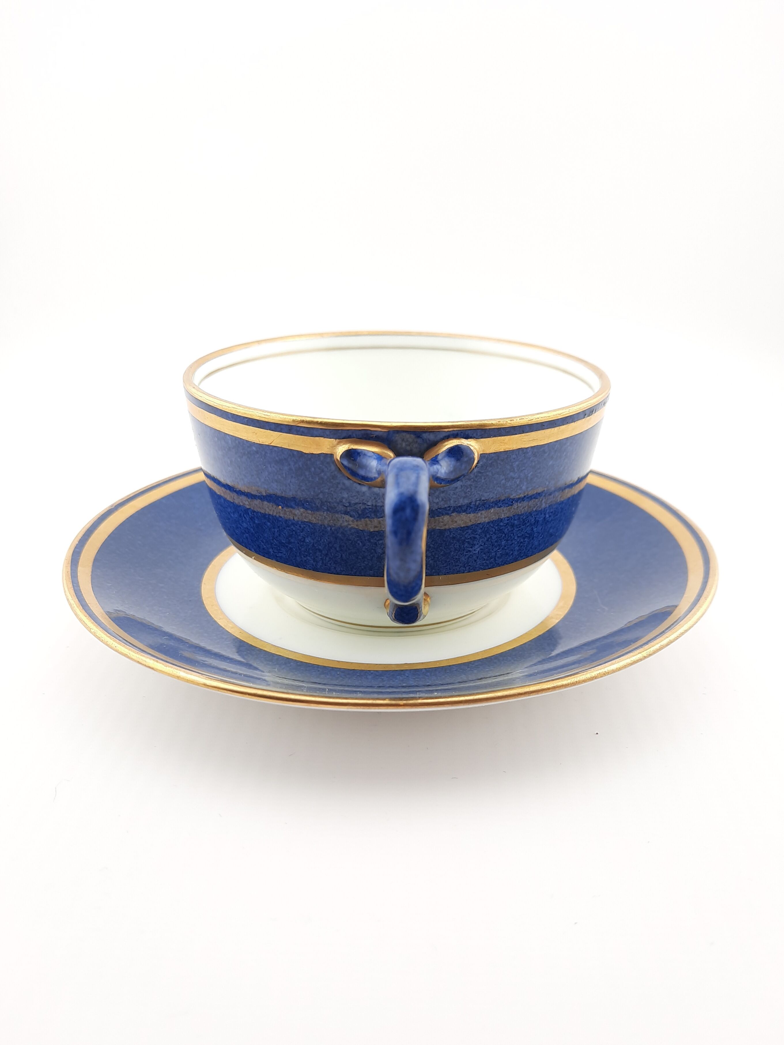 Antique Wedgwood teacup and saucer, bone china. Powder blue and gold English cup and saucer, 1900s