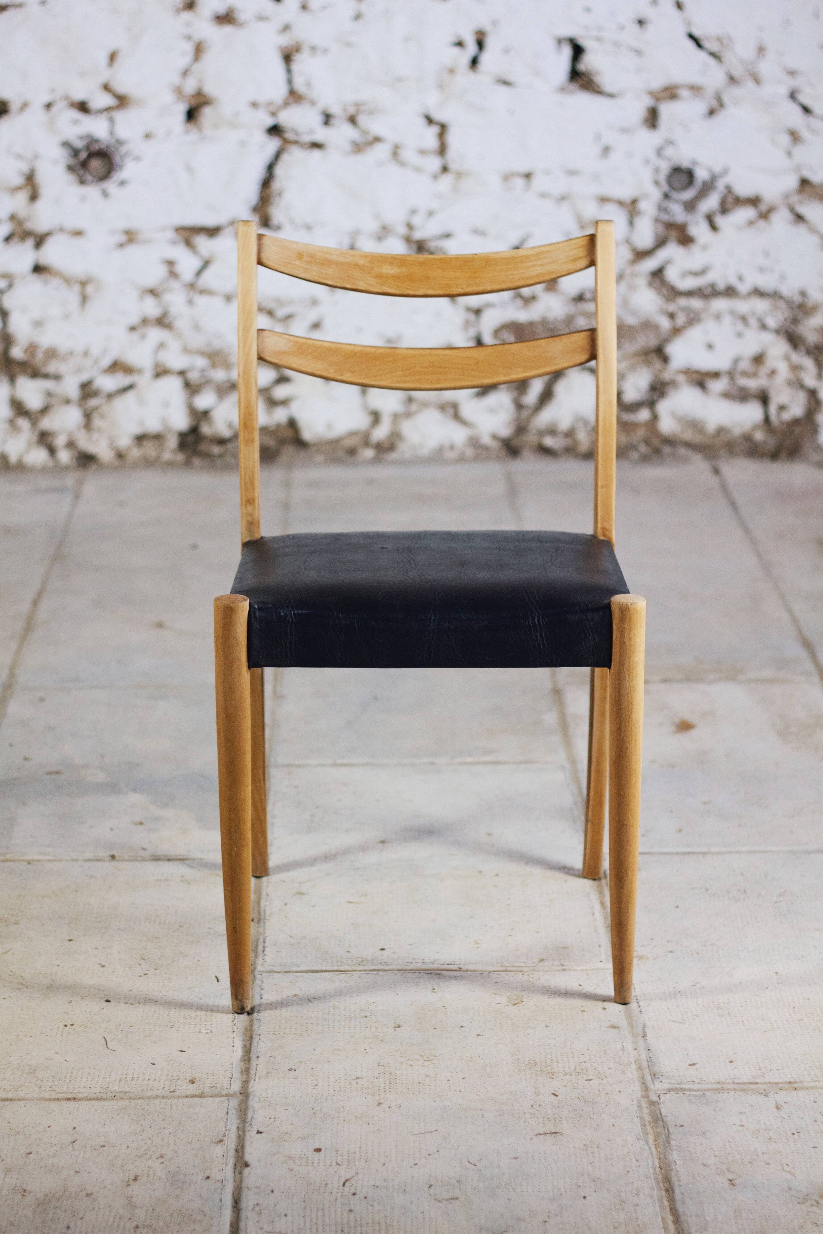 Pair of Scandinavian chairs in teak and faux leather, 1960.