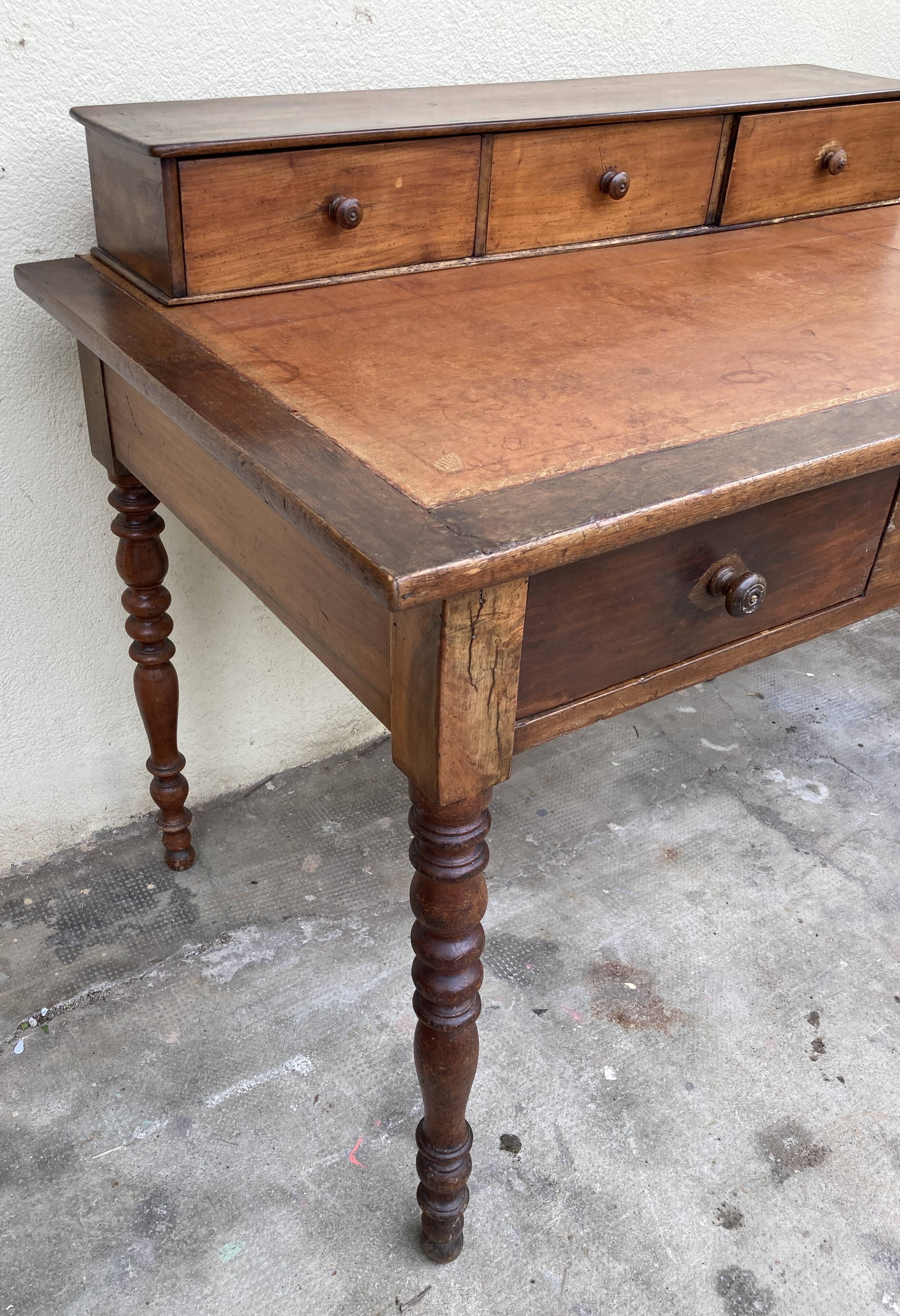 Antique desk with leather top and turned legs, 98 x 60.