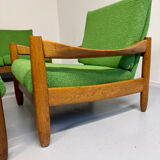 Living room sofa and Scandinavian design armchairs from the 1960s in green boucle.